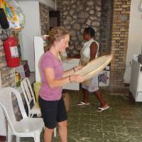 Anna Vander Boon winnowing rice for dinner at the house we stayed at in Deschapelles
